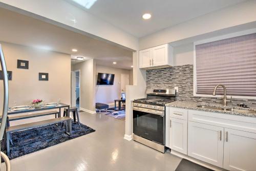 a kitchen with a sink and a stove top oven at Central Location! World Cup ATL HQ 5 Mi to Stadium in Atlanta
