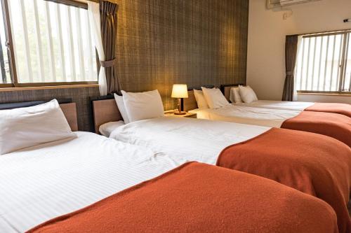 Postel nebo postele na pokoji v ubytování Bettei Gensen-Private Vacation Villa Bettei Gensen