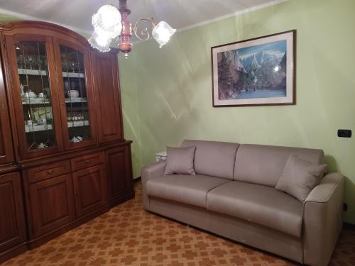 a living room with a couch and a cabinet at Il Larice in Salbertrand