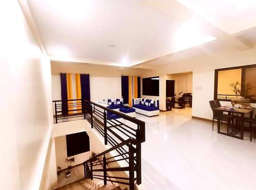 a large living room with a couch and a table at MS Residence Building in Lucban