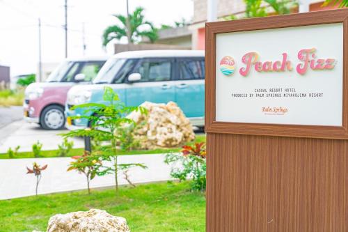 a sign for a garden centre with a car in the background at Palm Springs Miyakojima Resort in Miyako-jima