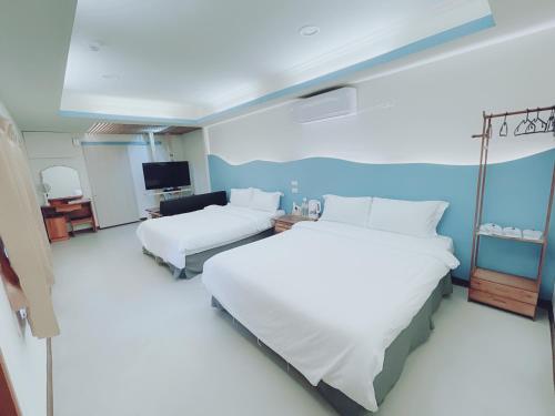 Tempat tidur dalam kamar di Long Jing Dive Resort