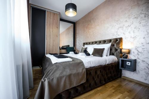 Ein Bett oder Betten in einem Zimmer der Unterkunft Apartman Sparta Zlatibor