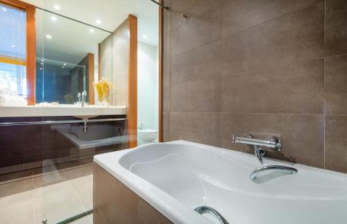 a bathroom with a sink and a mirror at Mas Ses Vinyes - Adults Only in Begur