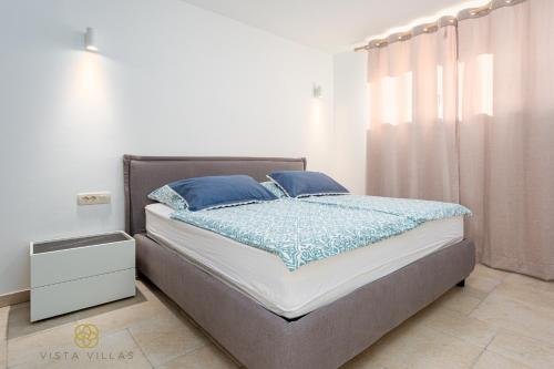 Posteľ alebo postele v izbe v ubytovaní Vista Villas - Lazy Days Apartment Villa N