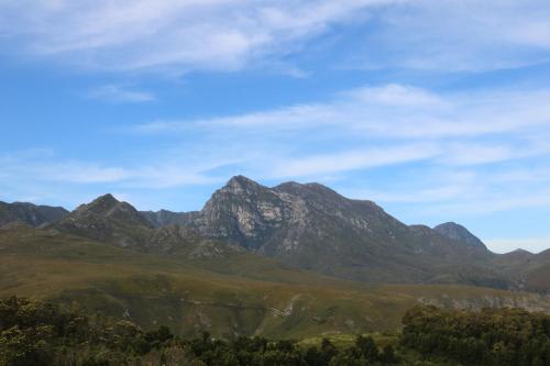 a mountain range with a blue sky and clouds at HighlandsView in Swellendam