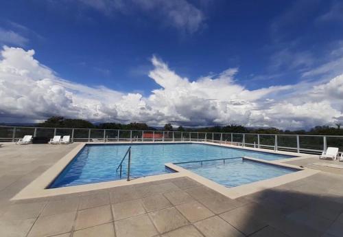 a large swimming pool on top of a building at Apartamento Tropical Playa Coronado in Playa Coronado