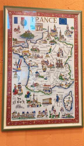 a framed map of france on a wall at 熊居民宿Lala Mountain Bear Farm in Hualing