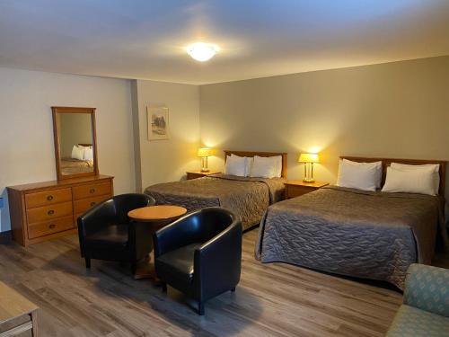 Postel nebo postele na pokoji v ubytování Hotel & Suites Monte-Cristo
