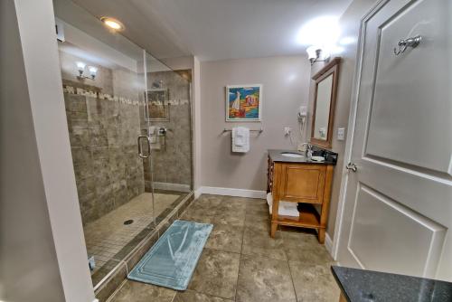 a bathroom with a shower and a sink at PierPark 2BR Beachfront Luxury Condo w View Sterling Breeze Resorts in Panama City Beach