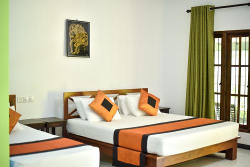 Postel nebo postele na pokoji v ubytování Tamarind Tamarind Resort, Tourist Board Approved