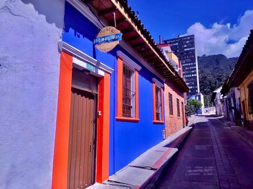 a colorful building on the side of a street at Hostal La Candelaria in Bogotá
