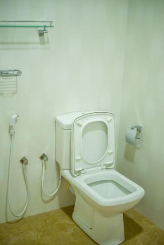 a bathroom with a toilet and a shower at Tamarind Tamarind Resort, Tourist Board Approved in Habarana