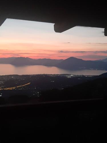 a view of a sunset over a body of water at CHALET in Patra