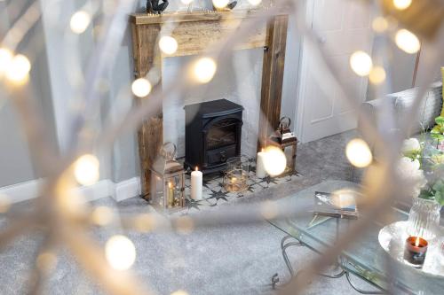 an overhead view of a living room with a fireplace at Stylish George Street Apartment in Peebles
