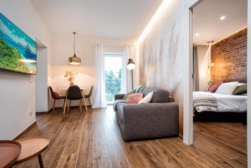 a living room with a couch and a bed at Casa Checca e Casa Maria appartamenti per vacanze in Caprarola