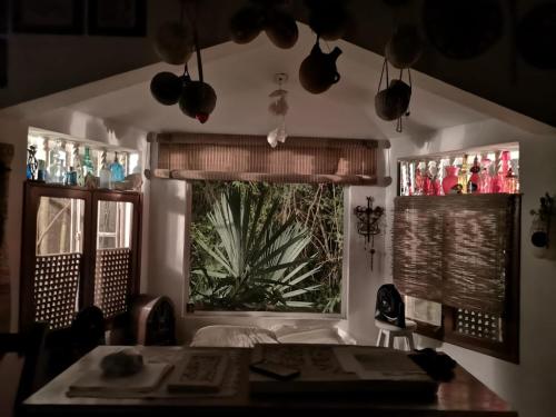 a kitchen with a sink and a large window at Casa del Arquitecto in Cancún