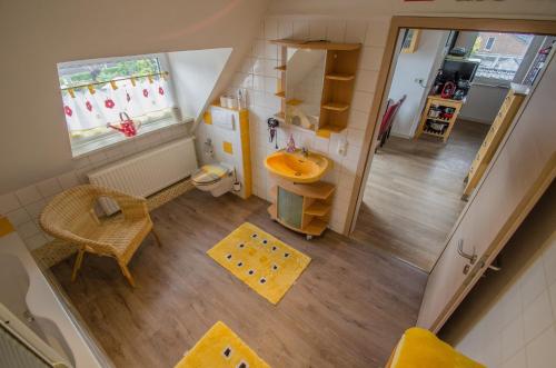 an overhead view of a small bathroom with a sink at Ferienwohnung Cologne in Frechen