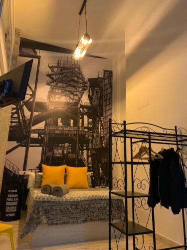 a bedroom with a bed with yellow pillows at Coco Homes in Madrid