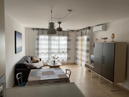 Ένα ή περισσότερα κρεβάτια σε δωμάτιο στο Beatriz del Mar - Apartamento con aire acondicionado