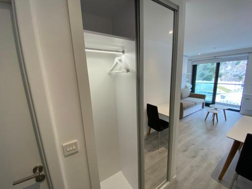 a sliding glass door in a room with a living room at Modern Studio Apartment at The Hub in Gibraltar