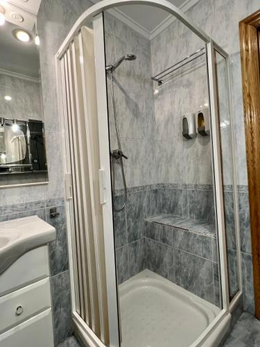 a bathroom with a shower and a sink at Mirador La Paz in Logroño