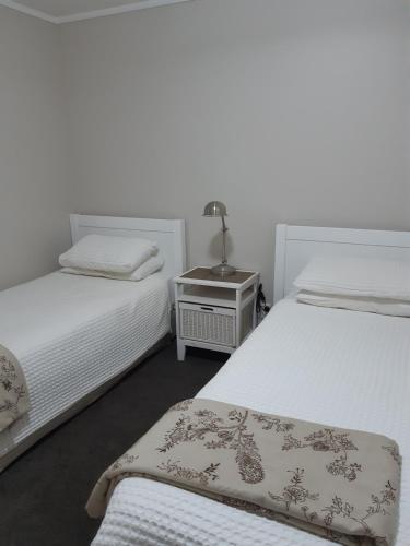 Ένα ή περισσότερα κρεβάτια σε δωμάτιο στο Mooring Lane Lodge