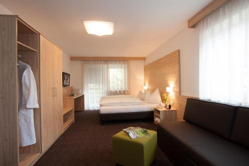 Postel nebo postele na pokoji v ubytování Hotel Stifter