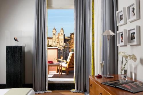 a hotel room with a view of a city at Portrait Roma - Lungarno Collection in Rome