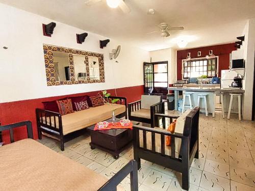 a living room with a couch and a table at Beachfront Apartment Hacienda del Cuyo in El Cuyo