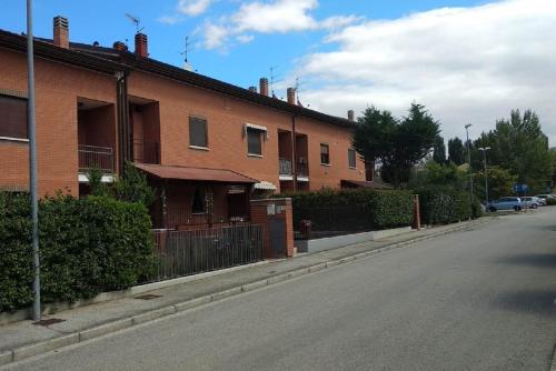 a brick house on the side of a street at A Casa di Kate b&b in Pila