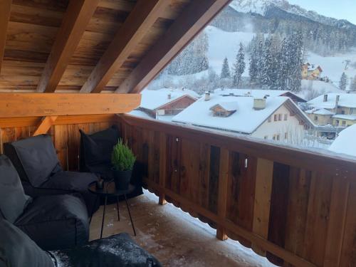 a balcony with a view of a snowy mountain at Appartements Innerkofler Mountain Home in San Candido