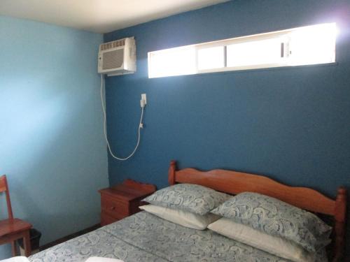 Katil atau katil-katil dalam bilik di Axios Sun Apartments Caye Caulker