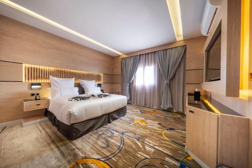 Krevet ili kreveti u jedinici u okviru objekta Msharef almoden hotel فندق مشارف المدن
