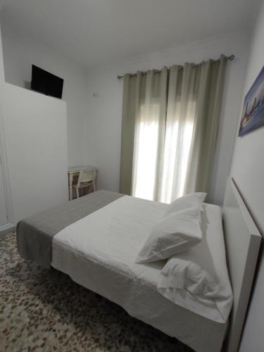 Katil atau katil-katil dalam bilik di Hostal Mellizo