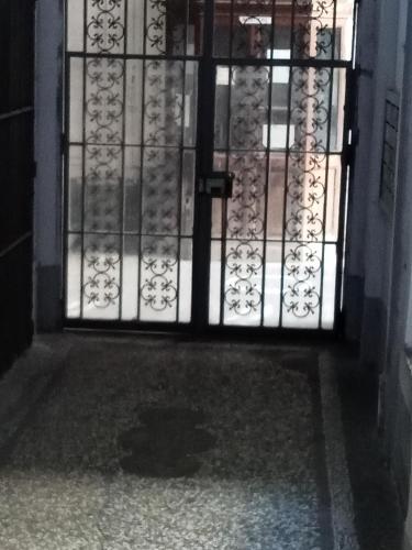 an open door with a window and a glass at Dama HostelBB in Naples