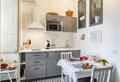 a kitchen with a table with food on it at I CARIZZI in Ragusa