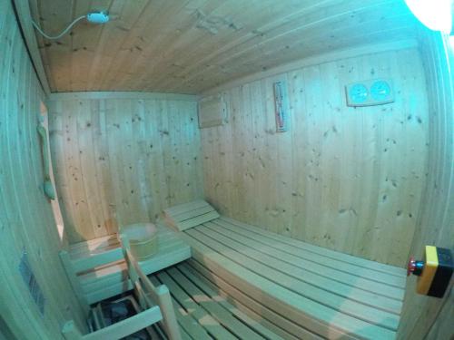 a small wooden sauna with a bench in it at il Riccio B&B in Ortona