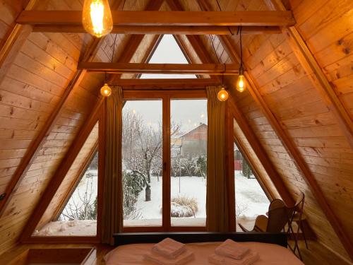 a room with a large window in a cabin at Petrovaradin Chalet in Novi Sad