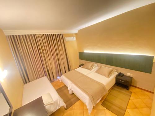 Postel nebo postele na pokoji v ubytování Hotel Alrawabi