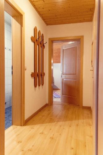 an empty room with a door and a wooden floor at Haus Sonja in Altaussee