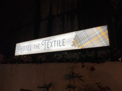 a sign that says order the settle on a wall at hotel the textile in Gifu