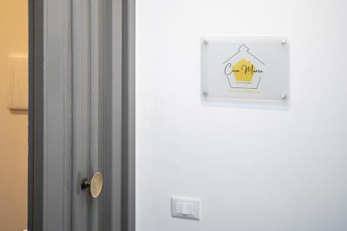 a door with a sign on the side of it at Casa Checca e Casa Maria appartamenti per vacanze in Caprarola