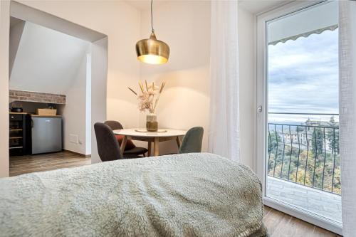 a bedroom with a bed and a table with chairs at Casa Checca e Casa Maria appartamenti per vacanze in Caprarola