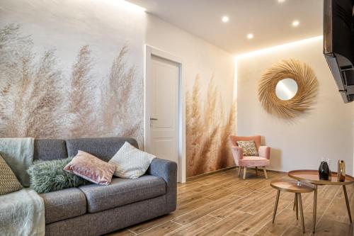 a living room with a couch and a table at Casa Checca e Casa Maria appartamenti per vacanze in Caprarola