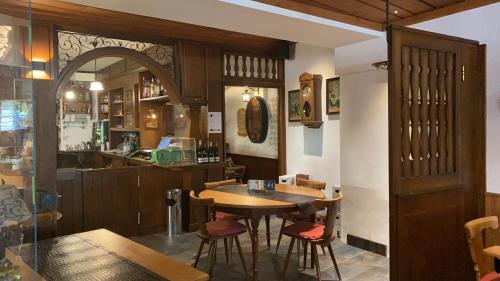 a dining room with a table and some chairs at Gasthaus Zum Hirschen in Staufen im Breisgau