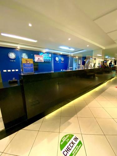 a baggage claim area in an airport with at Beira Mar Imperial Flat 612 in João Pessoa