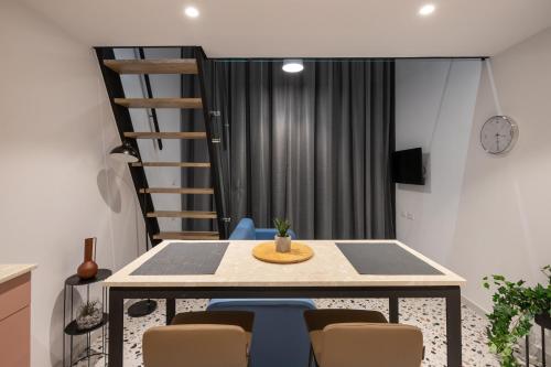 a dining room with a table and chairs at Spa & Pool - Studio Apartments 365 in Tirana