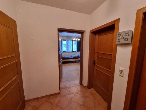 a hallway with two doors and a room with a hallway at Alina's DIY-Haus St.Jakob in Innere Großrotte