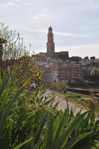 a city skyline with a clock tower in the distance at CASA PORTALICO in Jérica